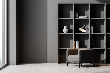 Living room interior with grey armchair, bookshelf concrete floor. Concept of cozy meeting reading place. 3d rendering © ImageFlow