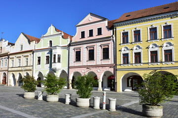 Fototapeta na wymiar facades of historic houses in square of town Trebon in Czech republic