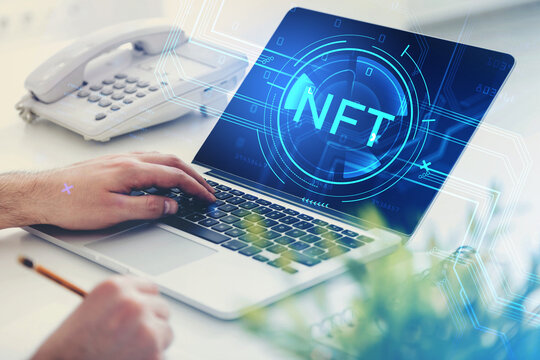 Businessman hand on laptop, digital hud with nft symbol and coding