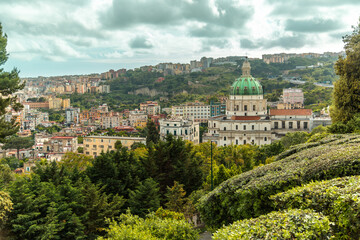 Fototapeta na wymiar Madre del Buon Consiglio (or Basilica dell'Incoronata Madre del Buon Consiglio) and panoramic scenic view of Naples, Campania, Italy