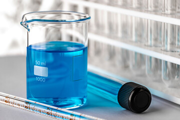 Tube and beaker with liquid inside