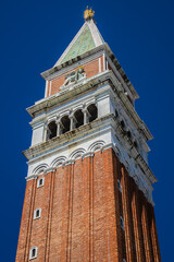 Fototapeta na wymiar 98.6 meters St Mark's Campanile (Campanile di San Marco, ninth century) - famous bell tower of St Mark's Basilica. Piazza San Marco, Venice, Italy.