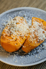 View of delicious sweet potatoes dish.Delicious sweet potatoes on plate high angle.Sweet potatoes with parmigiano