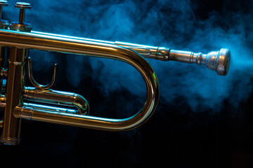 Fototapeta na wymiar Trumpet in mist and with colorful background