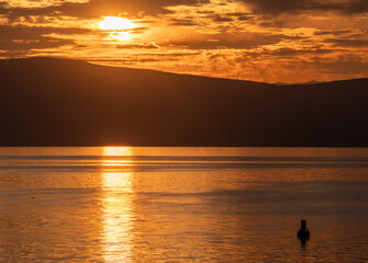 Fototapeta premium Beautiful calm lake with sunset