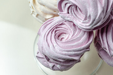 The marshmallow is curly in a glass vase. High quality photo
