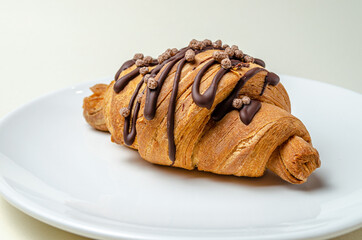 Croissants with strawberries and chocolate. High quality photo