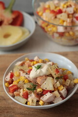 Salad with smoked chicken, pineapple, mayonnaise and herbes de Provence