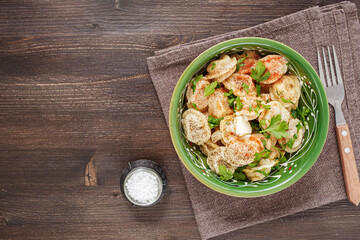 Meat dumplings on plate above with copy space