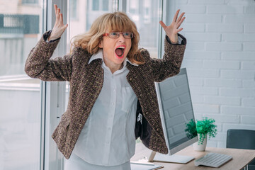 angry business woman screaming in the office