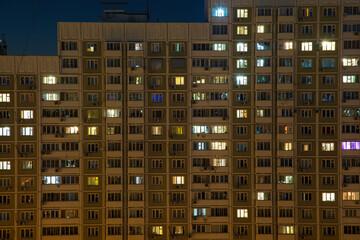 Night windows of a high-rise building in the big city