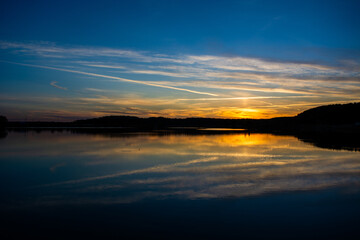Beautiful colored sunset over a calm lake
