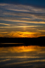 Beautiful colored sunset over a calm lake