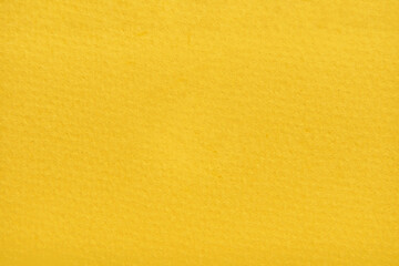 Yellow paper background. Grain rough blank sheet. Plain stylish backdrop. Craft card wallpaper. Modern graphic simple page. Nature letter surface. Sunny gold space