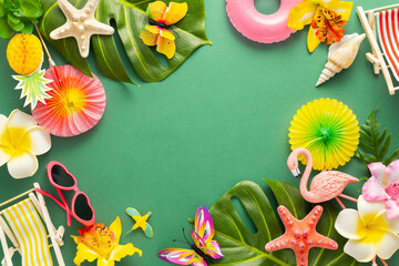 Exotic tropical summer background. Summer beach party concept. Pink flamingo, tropical leaves, orchid flowers and other accessories on green background. Flat lay, copy space.