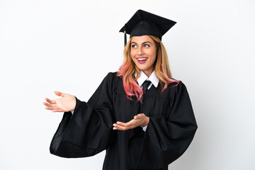 Young university graduate over isolated white background with surprise expression while looking side