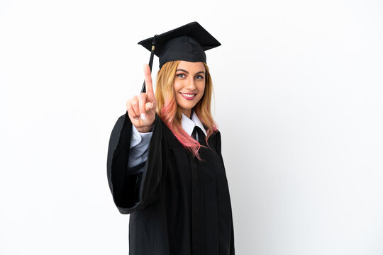 Young university graduate over isolated white background showing and lifting a finger