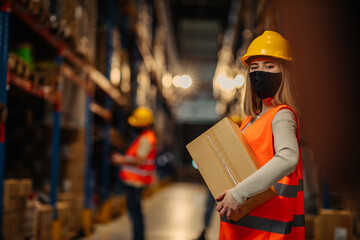 Warehouse employe working with boxes