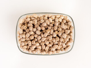 Chickpea in glass bowl on white background.