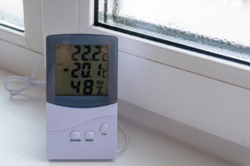 Home electronic thermometer shows the temperature outside -20 degrees of cold. Extreme cold snap....