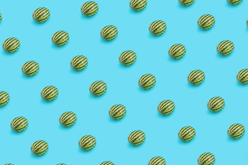 Summer pattern made of watermelons on pastel blue background