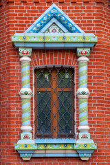 A picturesque window of an Orthodox church with a ceramic frame
