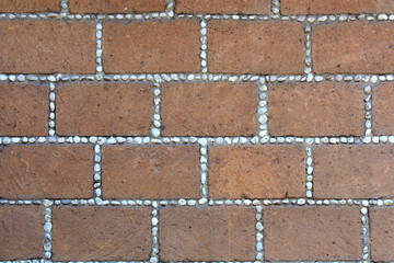 Texture of bricks made of stone. Stone wall from colonial times.