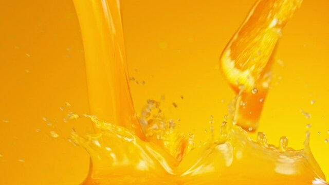 Super Slow Motion of Pouring Orange Juice. Filmed on High Speed Cinema Camera, 1000 fps.