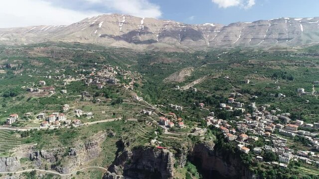 Beautiful village near the valley. Aerial footage of the city and valley. The environment. Best hiking trails. Middle East region. Summer vacation in Lebanon. Mountain trip. Valley sky view. Fun