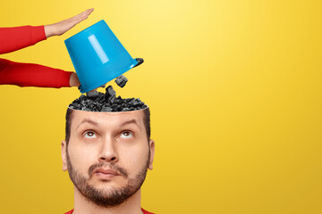 In the head, men are pouring trash from the bucket. The concept of unnecessary information,...