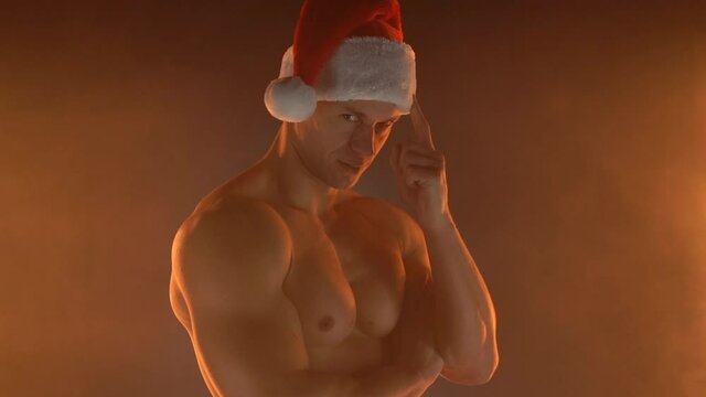 Christmas Man Santa hat naked torso pointing to head with one finger, great idea or thought, good memory Male caucasian athlete with perfect body Sport fitness healthy lifestyle concept Slow motion