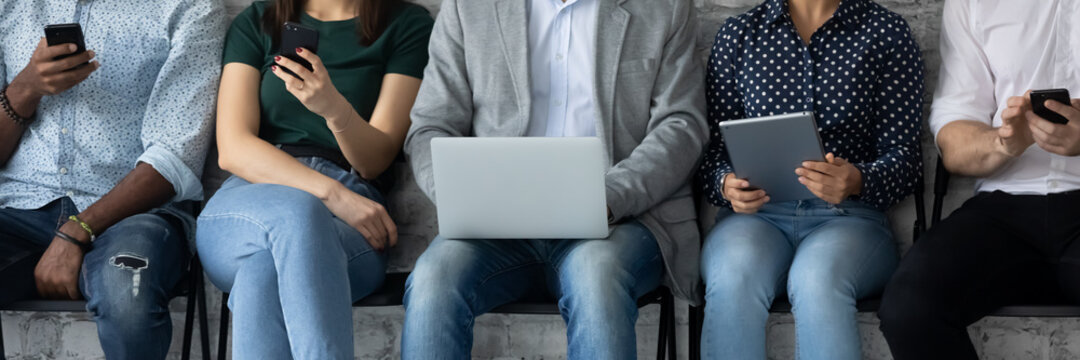 Diverse Group Of Customers Sitting In Line, Holding Digital Gadgets, Using Online Apps And Services On Smartphone, Laptops, Tablets For Work, Checking Messengers, Chatting On Social Media. Banner