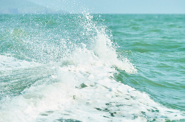 Texture of white wave in the ocean.