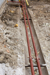 the flow and return steel pipes are placed underground into concrete ducts, pipes without insulation, old pipes 