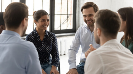 Happy millennial diverse group discussing personal problems, sharing experience, giving advice,...