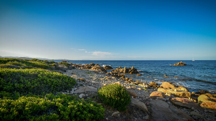 sea and rocks on the beach of sardinia