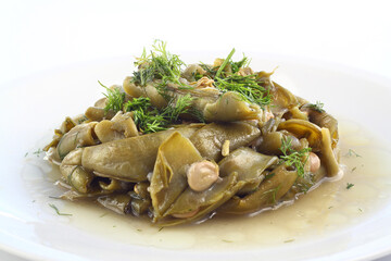 Broad bean and dill in the white plate with white background. close up broad bean. 