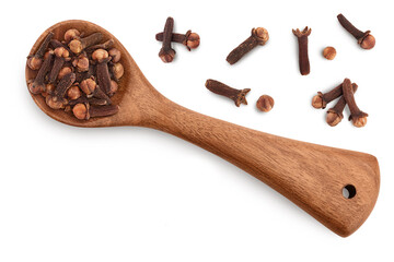 Dry spice cloves in wooden spoon isolated on white background. Top view with copy space for your text. Flat lay