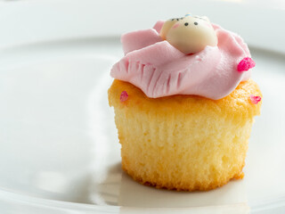 single cupcake on a white plate