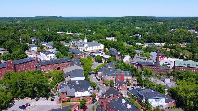 Amesbury historic downtown aerial view on Main Street including Market Square, Market Street Baptist Church and historic mill buildings in city of Amesbury, Massachusetts MA, USA.  