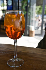 Refreshing cocktail with ice. Amber colored drink