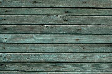 The texture of a wooden wall, an old planking board.
