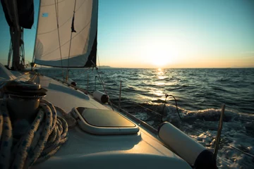 Foto auf Acrylglas An sail luxery Boat in regatta during sunset. © De Visu