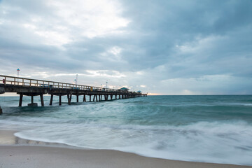 Fototapeta na wymiar Pompano Beach Pier Broward County Florida by stormy weather