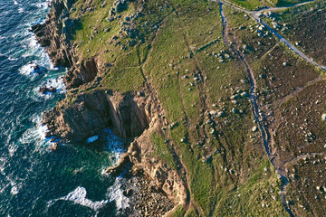 overhead drone photography of dramatic cliffs, sea or ocean, cliffs and countryside view