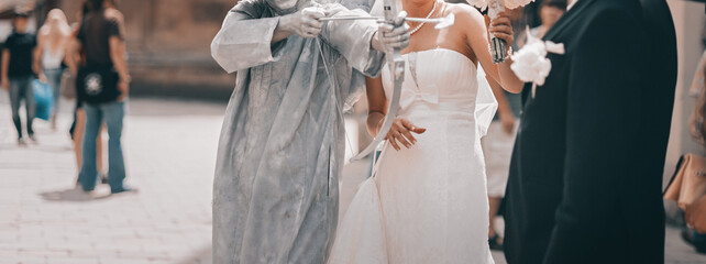 Bridal couple posing and celebrating wedding day, happy newlyweds bride and groom together.