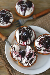 Delicious tartlets with cream cheese, chocolate and cherries. Healthy dessert with curd cheese. Mascarpone dessert. Keto dessert.