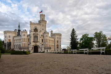A beautiful view of the neo-Gothic castle Hluboká nad Vltavou on a sunny day.