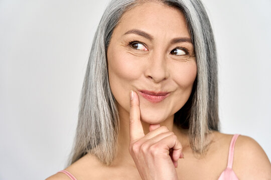 Middle Aged Happy Mature Asian Woman, Senior 50 Year Lady Looking Flirty Away,isolated On White Closeup Face Portrait. Ads Of Antiaging Uv Protection Whitening Menopause Dry Skincare, Plastic Surgery.