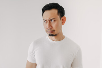 Grumpy face Asian man in white t-shirt isolated on white background.